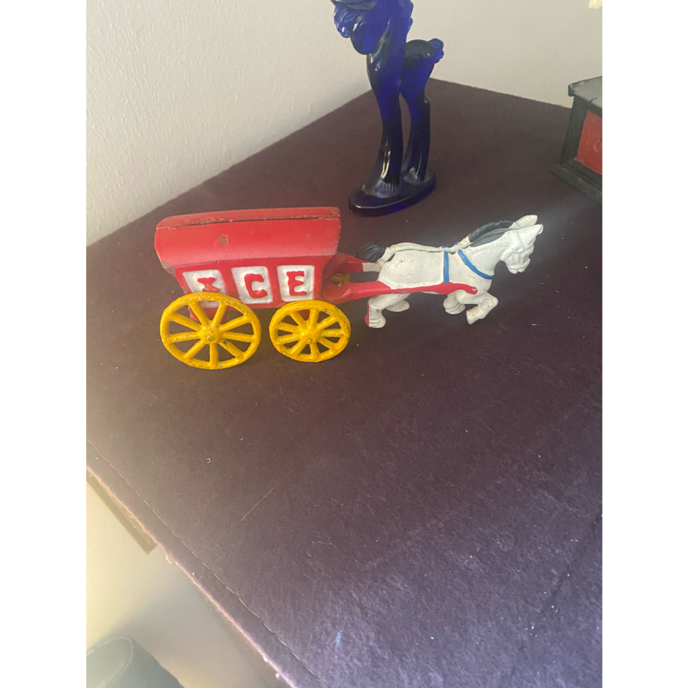 Metal ice truck pull bye a horse
